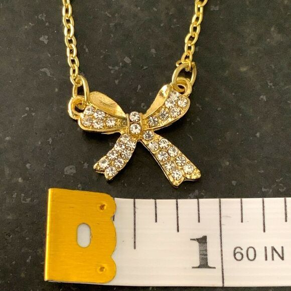 Gold-Plated Bow Pendant Necklace – Sculptural Unisex Design - Picture 7 of 11